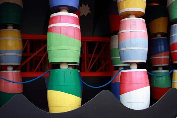 Colorful barrels at funhouse in fairground — Stock Photo, Image