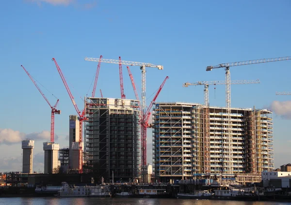 View of construction area with cranes near waterfront — Stock Photo, Image