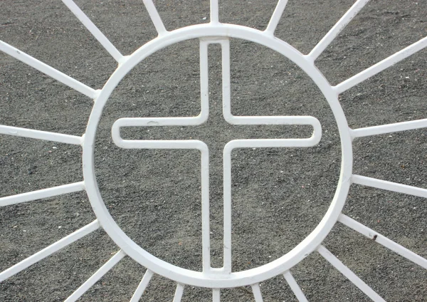 Detail of painted metal gate to old cemetery with a cross and su — Stock Photo, Image