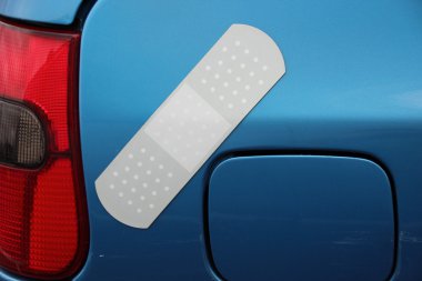 Plaster on blue car covering a small scratch clipart
