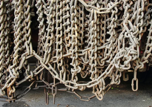 Industrial gray chains hanging on a truck — Stock Photo, Image