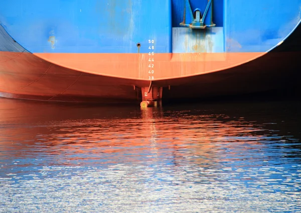 Ship stern with reflection in harbor water — Stock Photo, Image