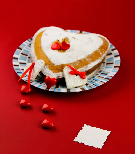 Valentines cake on the red background — Stock Photo, Image
