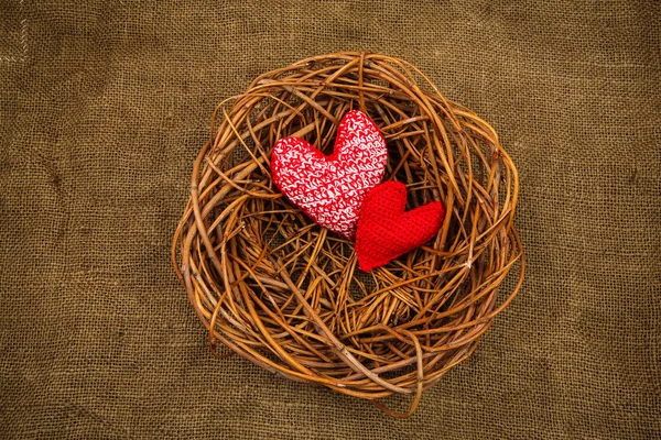 Knitting hearts in the nest — Stock Photo, Image