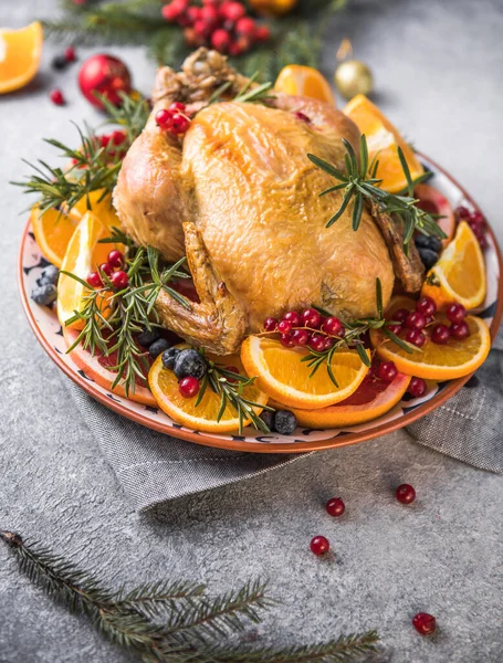 Roasted chicken or  turkey. Traditional festive food for Christmas or Thanksgiving. Christmas Dinner. Winter Holiday table setting. Xmas