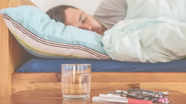 Sick Man Sleeping Bed Pills Water Glass Foreground Concept Illness — Stock Photo, Image
