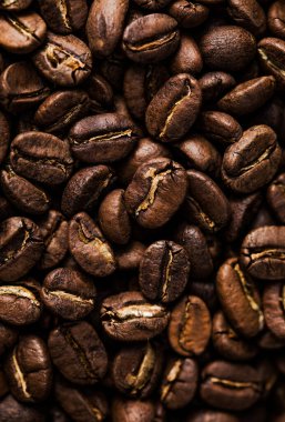 Kahve çekirdeği dokusu ya da kahve arkaplanı. Kokulu fasulye dumanı..