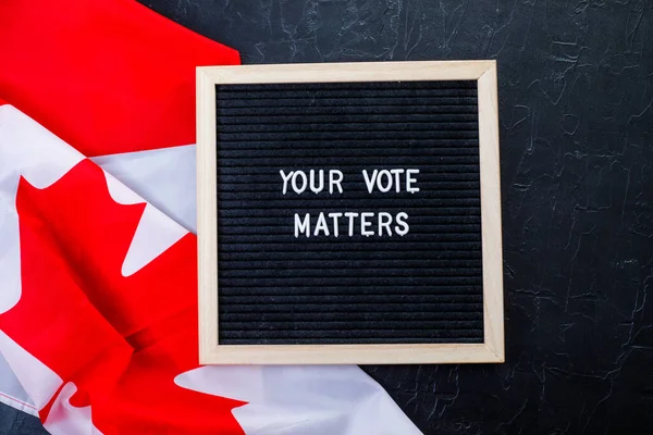 Letterboard Sign Words Your Vote Matters Canada Flag Black Background — стоковое фото