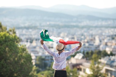 People holding flag of Mexico. 