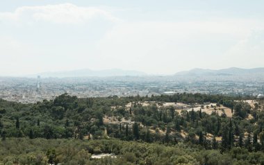View of old wall of Acropolis, city of Athens and Mount Lycabettus (right) in Athens, Greece