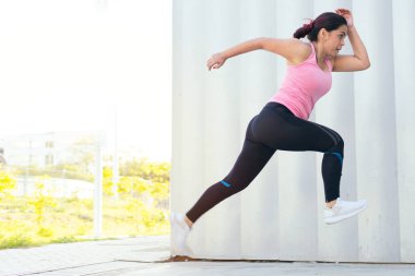 Young Woman During Jogging In Park