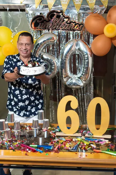 Hispanic Man Home Holding Birthday Cake Stock Image