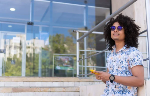 Businessman in the city using cell phone