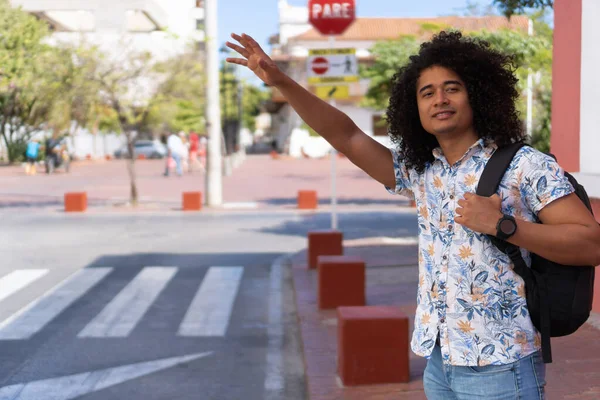 Afro Man Raising His Hand Hailing Cab Street Young Hispanic — Foto Stock