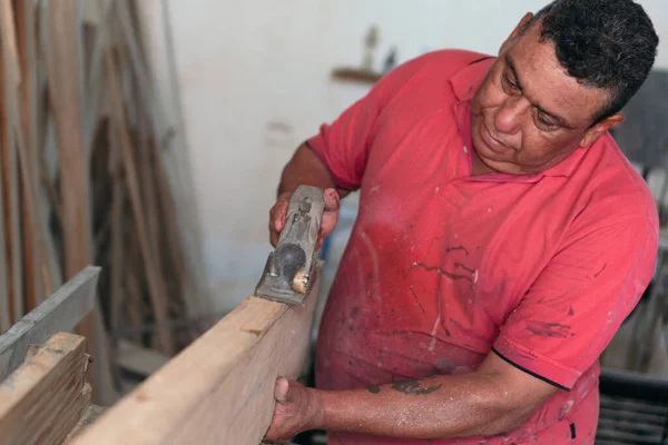 Man Places Finishing Details Piece Furniture — Fotografia de Stock