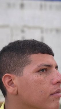 Latin Man with Freckles on his Face, looking at the Camera 