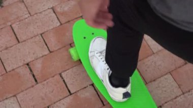 Top view of man on skateboard in park
