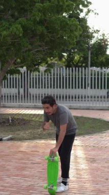 A skateboarder takes a break to train