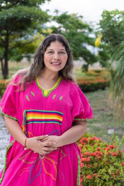 Portrait of Indigenous woman in traditional costume in the park