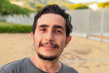 Young Hispanic man in the city, portrait