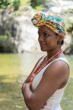 Woman with turban in the middle of the river