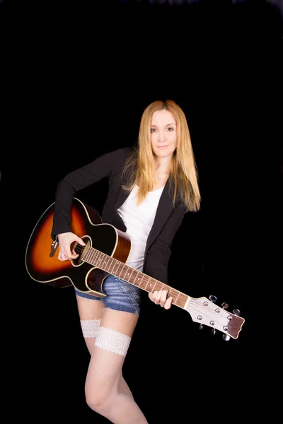 Chica en medias blancas toca la guitarra —  Fotos de Stock