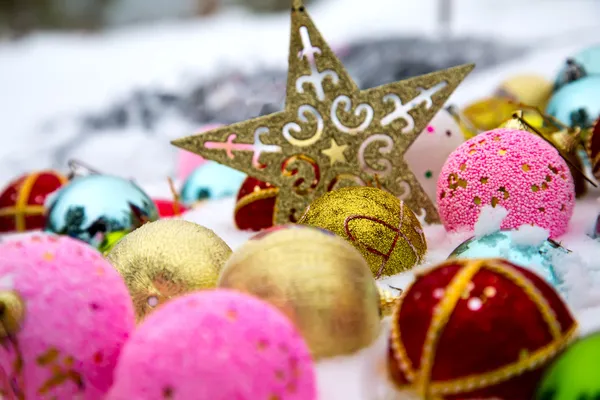 Christmas decorations on snow — Stock Photo, Image