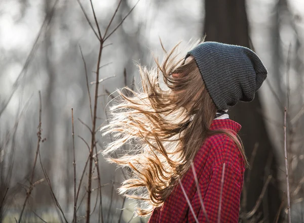 Portrait of beautiful girl with flying, blowing hair outdoors — Stock Photo, Image