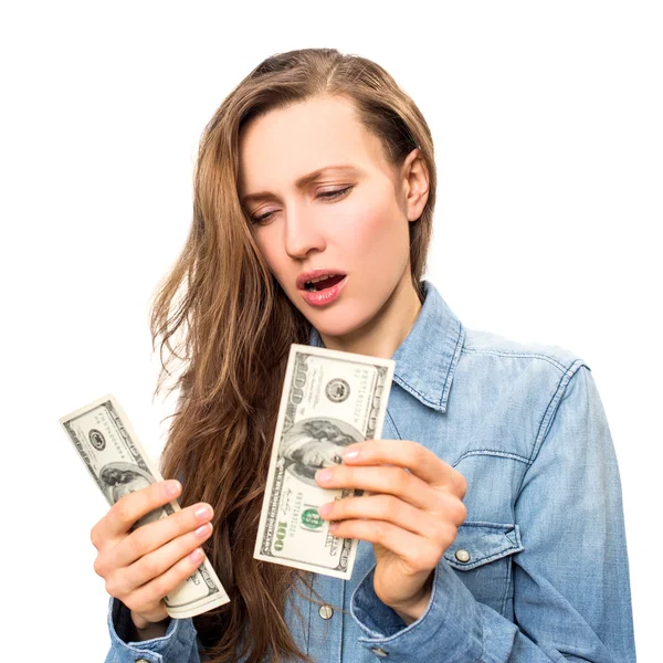 Disappointed young woman counting money — Stock Photo, Image