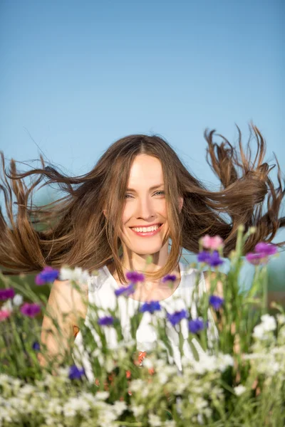 Pretty young girl with flying hair — Stock Photo, Image