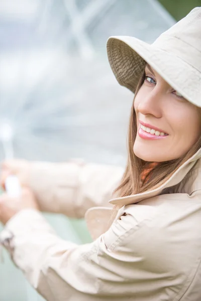 Smiling woman with umbrella — Stock Photo, Image