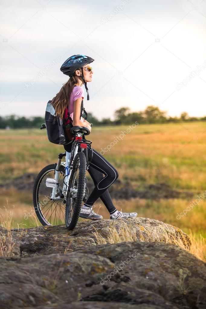Tourist cyclist with backpack relaxing