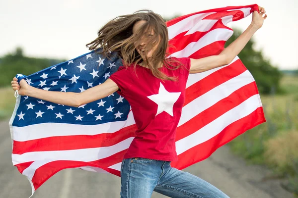 Young happy woman with American flag — Stock Photo, Image