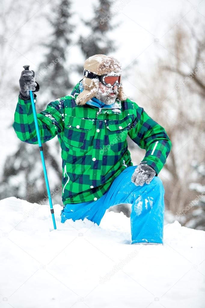 Man traveler hiking in winter