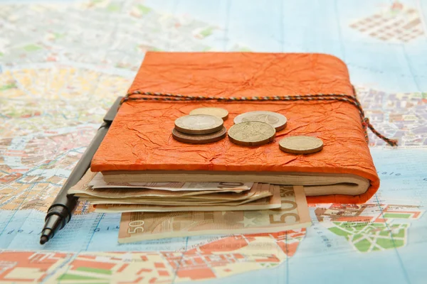 Travel Arrangement of Euro money, Map and notepad diary