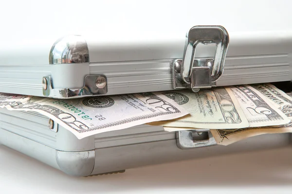 Silver suitcase with Dollar notes showing — Stock Photo, Image