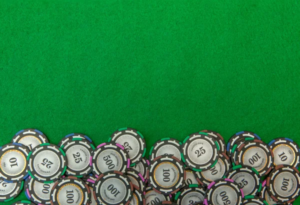 Casino chips on green background — Stock Photo, Image