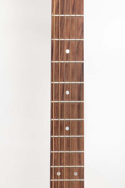 Closeup shot of dark guitar fingerboard