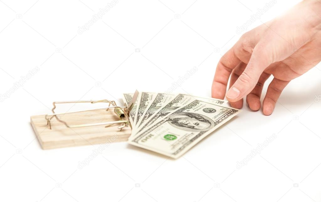 Photo on white of men hand taking money from mouse trap