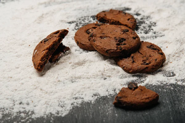 Cookies with chocolate on a black background.