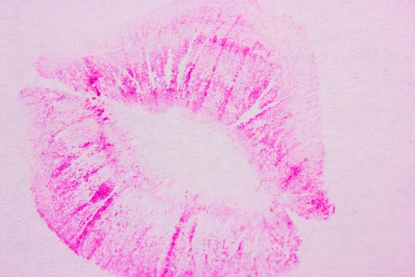Bright pink female lip print on white background. Kiss, smack, lipstick print, mark. Femininity, flirt, love concept. World Kissing Day. Valentine\'s Day. Lovely backdrop. Watercolor print on a paper.