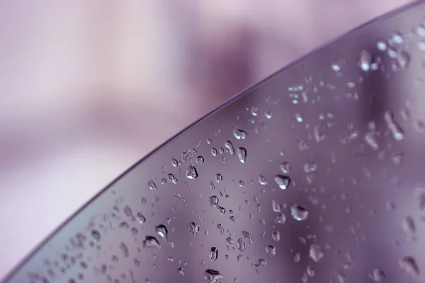 A car window lowered with raindrops on it. Travel in rainy weather, autumn, fall — Stock Photo, Image