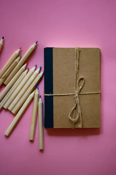 Eco cardboard notepad for notes, tied with sacking rope bow flatly. Wooden pink pencil for journal entries, set of wooden pencils. Feminine secrets. Accessories for studying drawing, female planning.