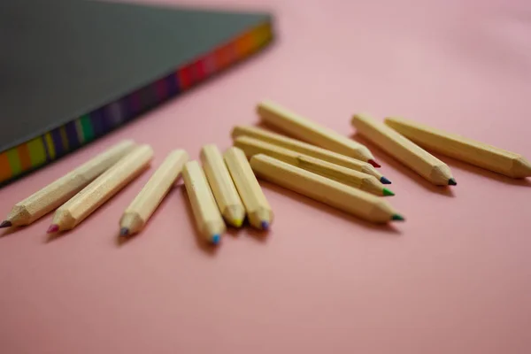 Stylish Notepad Scratchbook Notebook Notes Multicolored Wooden Pencils Lying Pink — Fotografia de Stock