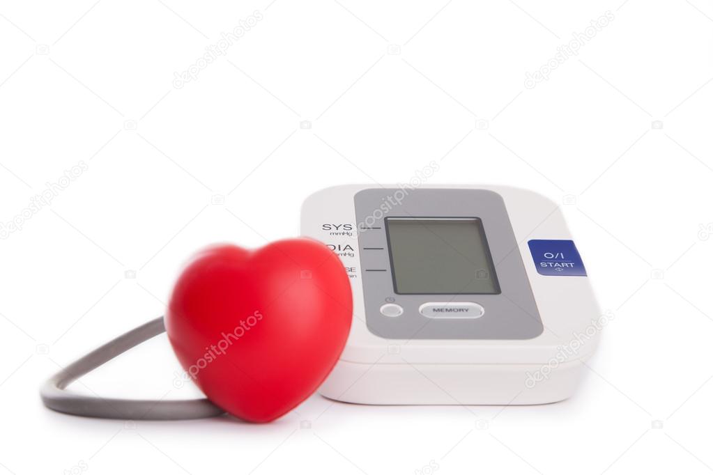red heart in front of blood pressure meter