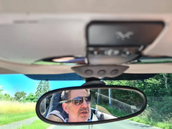 Reflection Senior Mans Eyes Rearview Mirror Car Wet Windshield — Stock Photo, Image