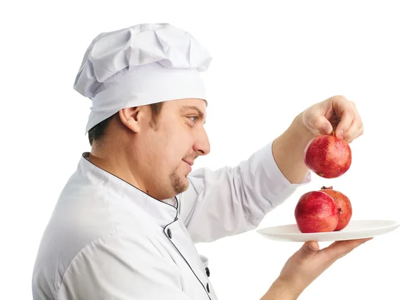 Šéfkuchař s granátová jablka — Stock fotografie
