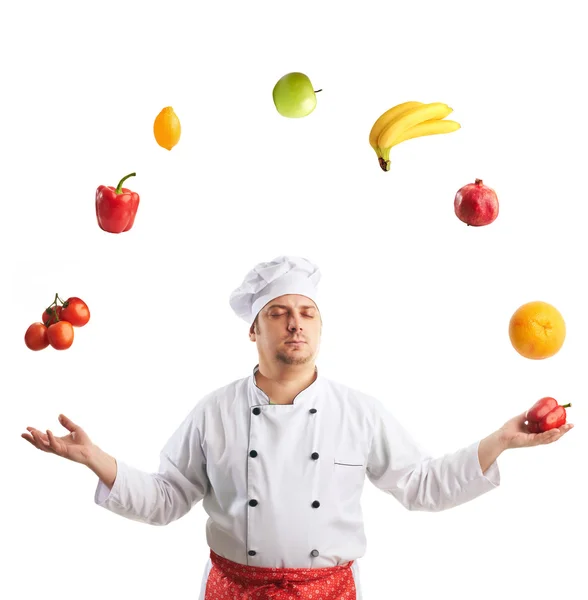 Chef juggles fruit and vegetables — Stock Photo, Image