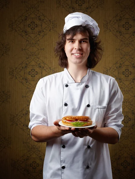 Cook with sandwich — Stock Photo, Image