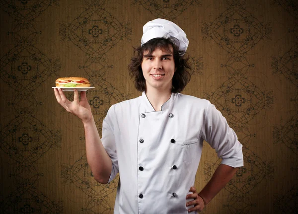Koch mit Sandwich — Stockfoto